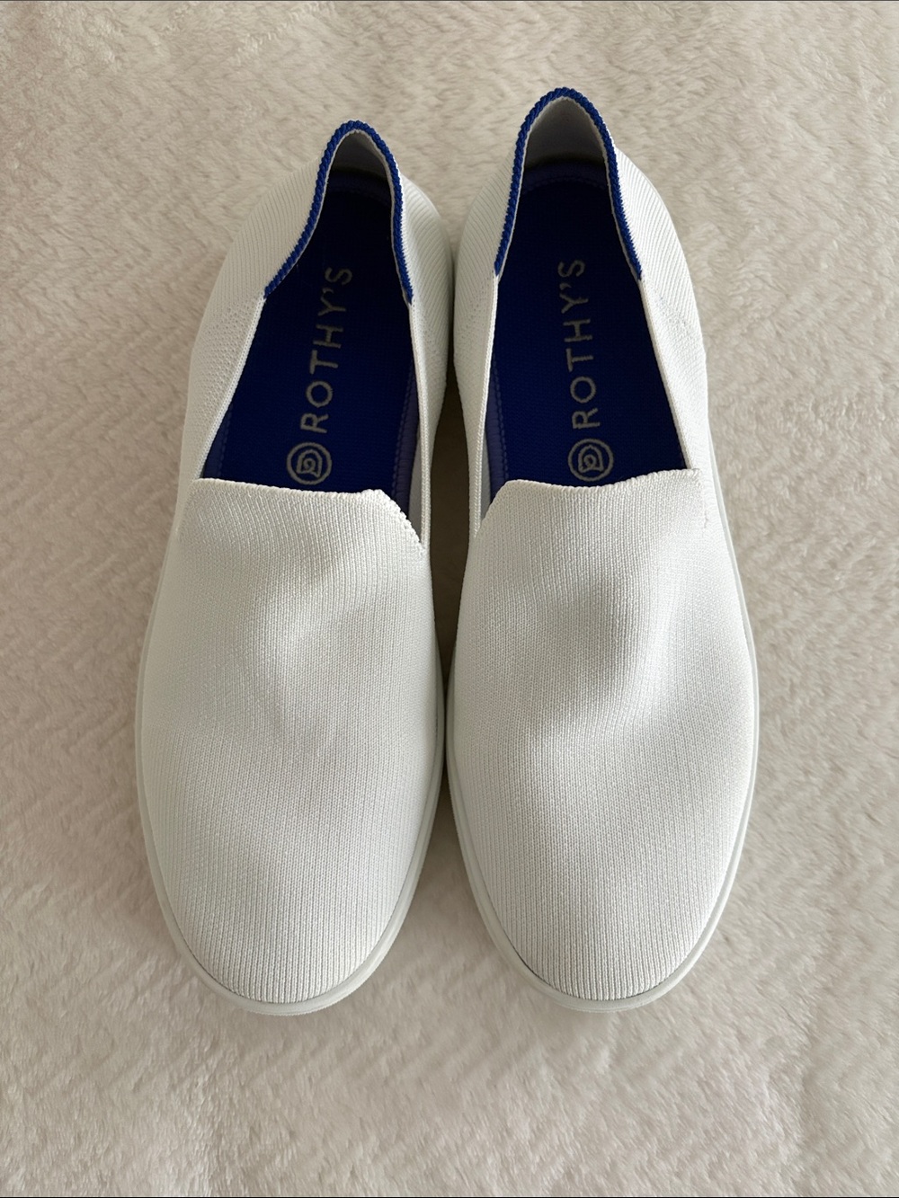 Rothy's White Slip-On Sneakers with Blue Heel Trim